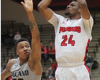 William D. Lewis The Vindicator  YSU Cam Morse(24) shoots over Oakland's Sherron Dorsey-Walker(30) during Feb 2, 2017 action at YSU.