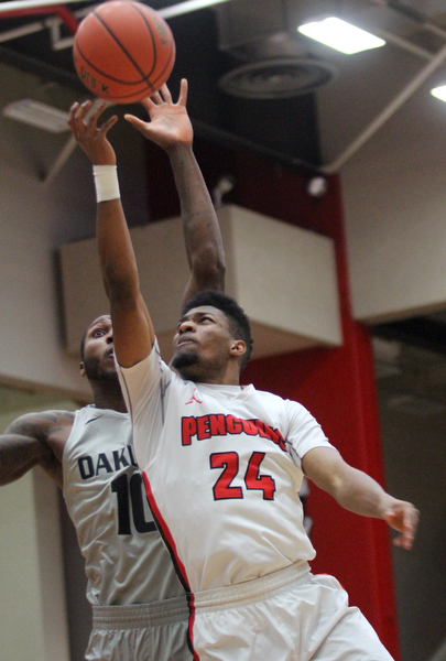William D. Lewis The Vindicator  YSU Cam Morse(24) shoots over Oakland's Isiah Brock (10) during Feb 2, 2017 action at YSU.