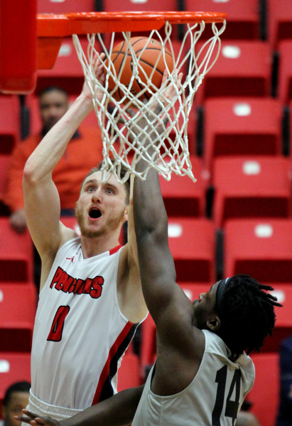 William D. Lewis The Vindicator  YSU Matt Donlan(0) shoots over Oakland's Xavier Hill-Mais(14)) during Feb 2, 2017 action at YSU.