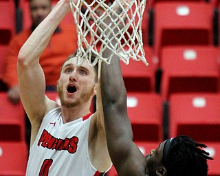William D. Lewis The Vindicator  YSU Matt Donlan(0) shoots over Oakland's Xavier Hill-Mais(14)) during Feb 2, 2017 action at YSU.
