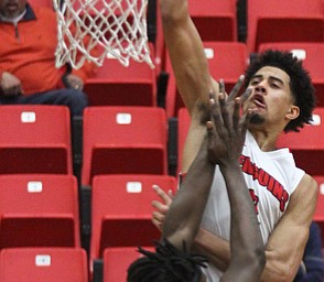 William D. Lewis The Vindicator  YSU Davin Haygood(2) shoots over Oakland's Xavier Hill-Mais(14)) during Feb 2, 2017 action at YSU.