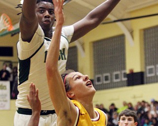 William D. Lewis The Vindicator Mooney's Alex Wollet(3) shoots around Ursuline's Anthony Howell(1) during 2/3/17 action at Ursuline Please check spelling. Scorers handwriting was nearly unreadable.