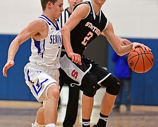 POLAND, OHIO - FEBRUARY 3, 2017: Carson Ryan #2 of Struthers attempts to dribble up court while being pressured by Mike Diaz #2 of Poland during the first half of their game Friday night at Poland High School. DAVID DERMER | THE VINDICATOR
