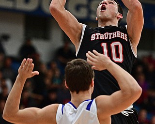 POLAND, OHIO - FEBRUARY 3, 2017: AJ Musolino #10 of Struthers goes tot he basket while Trent Lutz #4 of Poland gets out of the way during the first half of their game Friday night at Poland High School. DAVID DERMER | THE VINDICATOR