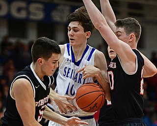 POLAND, OHIO - FEBRUARY 3, 2017: Daniel Kramer #10 of Poland has the ball knocked out his control by Andrew Carbon #5 of Struthers while being pressured from behind by Ryan Leonard #20 during the second half of their game Friday night at Poland High School. DAVID DERMER | THE VINDICATOR