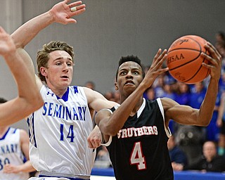 POLAND, OHIO - FEBRUARY 3, 2017: Jajuan Douglas #4 of Struthers goes to the basket while being pursued by Konnor Morse #14 of Poland during the second half of their game Friday night at Poland High School. DAVID DERMER | THE VINDICATOR