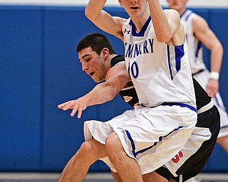 POLAND, OHIO - FEBRUARY 3, 2017: Daniel Kramer #10 of Poland protects the ball from the reach of AJ Musolino #10 of Struthers during the second half of their game Friday night at Poland High School. DAVID DERMER | THE VINDICATOR