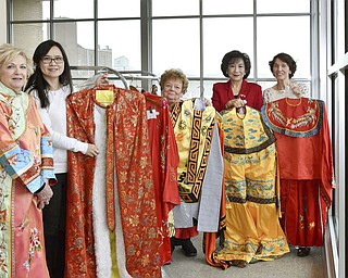 SPECIAL TO THE VINDICATOR: 
Preparing for the Chinese New Year Festival set for Saturday at the DeYor Performing Arts Center are Youngstown Symphony Organization committee members Rose D’Eramo, left, Christine Sung, Lynn Doyle Pebworth, Florence Wang and Maria Latorre, posing with garments that will be modeled during the reception.