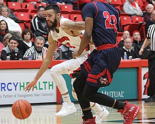 Youngstown State Penguins junior guard Francisco Santiago(23) charges towards the net during the first half as Detroit Mercy University takes on Youngstown State at the Beeghly Center at Youngstown State University in Youngstown on Saturday, Feb. 4, 2017. Detroit Mercy won, 90-80...(Nikos Frazier | The Vindicator)..