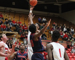 Youngstown State Penguins junior guard Cameron Morse(24) flies towards the net during the first half as Detroit Mercy University takes on Youngstown State at the Beeghly Center at Youngstown State University in Youngstown on Saturday, Feb. 4, 2017. Detroit Mercy won, 90-80...(Nikos Frazier | The Vindicator)..