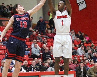 Youngstown State Penguins freshman guard Braun Hartfield(1) goes up for three as Detroit Mercy freshman forward Cole Long(13) attempts to block his shot during the first half as Detroit Mercy University takes on Youngstown State at the Beeghly Center at Youngstown State University in Youngstown on Saturday, Feb. 4, 2017. Detroit Mercy won, 90-80...(Nikos Frazier | The Vindicator)..