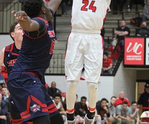 Youngstown State Penguins junior guard Cameron Morse(24) goes up for three during the first half as Detroit Mercy University takes on Youngstown State at the Beeghly Center at Youngstown State University in Youngstown on Saturday, Feb. 4, 2017. Detroit Mercy won, 90-80...(Nikos Frazier | The Vindicator)..