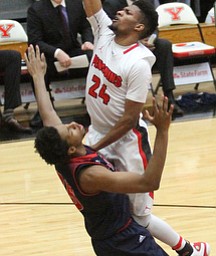 Youngstown State Penguins junior guard Cameron Morse(24) goes up for two as Detroit Mercy sophomore forward Gerald Blackshear Jr.(25) goes down to the wood with him during the first half as Detroit Mercy University takes on Youngstown State at the Beeghly Center at Youngstown State University in Youngstown on Saturday, Feb. 4, 2017. Detroit Mercy won, 90-80...(Nikos Frazier | The Vindicator)..