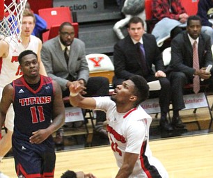 Youngstown State Penguins junior guard Cameron Morse(24) goes up for two as Detroit Mercy sophomore forward Gerald Blackshear Jr.(25) goes down to the wood with him during the first half as Detroit Mercy University takes on Youngstown State at the Beeghly Center at Youngstown State University in Youngstown on Saturday, Feb. 4, 2017. Detroit Mercy won, 90-80...(Nikos Frazier | The Vindicator)..