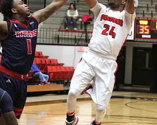 Youngstown State Penguins junior guard Cameron Morse(24) goes up for two against Detriot Mercy freshman guard Corey Allen(1) during the second half as Detroit Mercy University takes on Youngstown State at the Beeghly Center at Youngstown State University in Youngstown on Saturday, Feb. 4, 2017. Detroit Mercy won, 90-80...(Nikos Frazier | The Vindicator)..