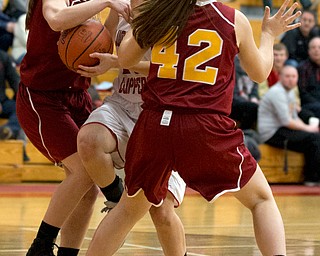 MICHAEL G TAYLOR | THE VINDICATOR- 02-04-17 -Basketball-  1st qtr., Columbiana's #20 Alexis Cross'  drive is defended by Mooney's #14 Camden Hergenrother (left) and #42 Concmetta Rinaloi.  Lady Basketball- Cardinal Mooney vs Columbiana Clippers at Columbiana High School in Richard Berryman Gymnasium, Columbiana,, OH