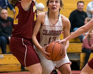 MICHAEL G TAYLOR | THE VINDICATOR- 02-04-17 -Basketball-  1st qtr., Columbiana's #13 Marian Rovnak  drives to the hoop against Mooney's #14 Camden Hergenrother (hand on the ball) and #32 Caitlyn Sapp.  Lady Basketball- Cardinal Mooney vs Columbiana Clippers at Columbiana High School in Richard Berryman Gymnasium, Columbiana,, OH