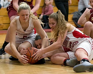 MICHAEL G TAYLOR | THE VINDICATOR- 02-04-17 -Basketball-  3rd qtr., Columbiana's #5 Tessa Liggett (left),  Columbiana's #22 Brittany Mook (right) and Mooney's #42 Concmetta Rinaloi battle for the loose ball.  Lady Basketball- Cardinal Mooney vs Columbiana Clippers at Columbiana High School in Richard Berryman Gymnasium, Columbiana, OH.