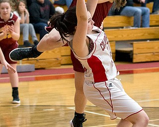 MICHAEL G TAYLOR | THE VINDICATOR- 02-04-17 -Basketball-  Late 4th qtr., Columbiana's #15 Kennedy Fullum draws the charge against Mooney's #42 Concmetta Rinaloi.  Lady Basketball- Cardinal Mooney vs Columbiana Clippers at Columbiana High School in Richard Berryman Gymnasium, Columbiana,, OH