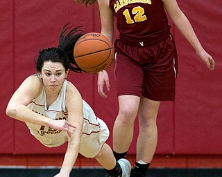 MICHAEL G TAYLOR | THE VINDICATOR- 02-04-17 -Basketball-  1st qtr., Columbiana's #15 Kennedy Fullum dives to throw a pass as Mooney's #12 Taylor Martin defends.  Lady Basketball- Cardinal Mooney vs Columbiana Clippers at Columbiana High School in Richard Berryman Gymnasium, Columbiana,, OH