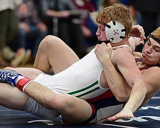 AUSTINTOWN, OHIO - FEBRYARY 4, 2017: AJ Stehura of Fitch drags Cameron Martig of West Branch down to the mat during their 152lb championship bout Saturday night at Austintown Fitch High School. DAVID DERMER | THE VINDICATOR