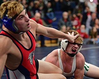 AUSTINTOWN, OHIO - FEBRYARY 4, 2017: Cameron Martig of West Branch has his eye poked by AJ Stehura of Fitch as he falls to the mat during their 152lb championship bout Saturday night at Austintown Fitch High School. DAVID DERMER | THE VINDICATOR