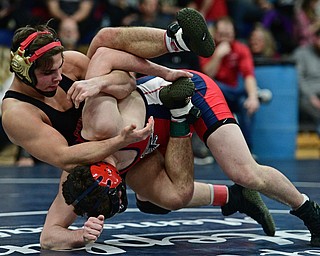 AUSTINTOWN, OHIO - FEBRYARY 4, 2017: Georgio Poullas of Canfield controls the back of Michael Ferree of Fitch during their 160lb championship bout Saturday night at Austintown Fitch High School. DAVID DERMER | THE VINDICATOR