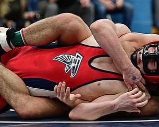 AUSTINTOWN, OHIO - FEBRYARY 4, 2017: Georgio Poullas of Canfield controls the back of Michael Ferree of Fitch while the two wrestle on the mat during their 160lb championship bout Saturday night at Austintown Fitch High School. DAVID DERMER | THE VINDICATOR
