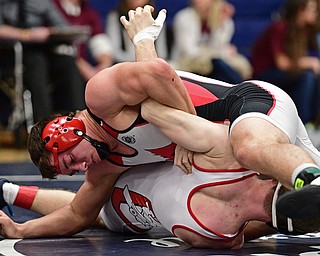 AUSTINTOWN, OHIO - FEBRYARY 4, 2017: David Crawford of Canfield controls the body of Nathan Whitehead of Columbiana during their 170lb championship bout Saturday night at Austintown Fitch High School. DAVID DERMER | THE VINDICATOR
