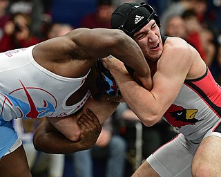 AUSTINTOWN, OHIO - FEBRYARY 4, 2017: Dominic Cooper of Canfield braces for a charge from Duce Johnson of Alliance during their 182lb championship bout Saturday night at Austintown Fitch High School. DAVID DERMER | THE VINDICATOR