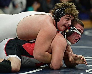AUSTINTOWN, OHIO - FEBRYARY 4, 2017: Ian Sharp of West Branch controls the back of Mason Giordano of Canfield during their 285lb championship bout Saturday night at Austintown Fitch High School. DAVID DERMER | THE VINDICATOR