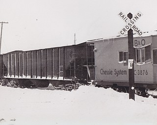 Train too gets stuck in the snow -- A Chessie System Train, stuck in 16-foot snow drifts several funded feet up the rail line, blocks the rail crossing on Route 534 in Farmington Township. The 30-car train was traveling at about 40 miles an hour when it plowed into the drifts in rural Trumbull County. There were no injuries. Efforts to free the train were expected to take all day.