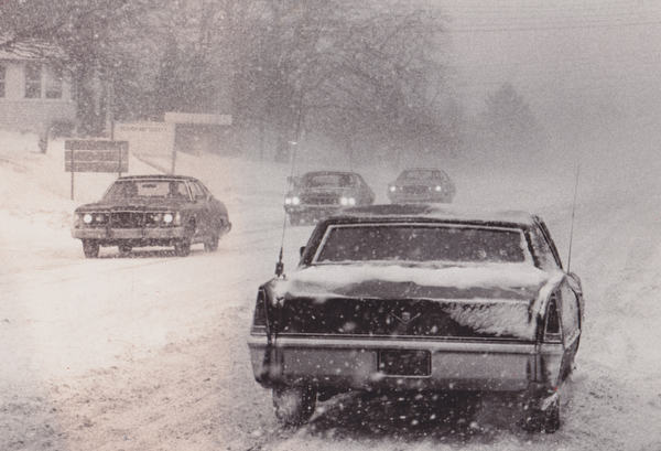 Locally, motorists returning home Friday after early business and industry closings found traffic at a near standstill for about an hour as high winds and blowing snow made visibility almost zero. THis scene on Belmont Ave was common in the area.