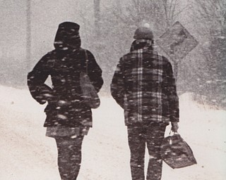 Schools throughout the Mahoning Valley closed early Friday in the wake of the blizzard, which dropped temperatures by more than 10 degrees in less than 60 minutes. The overnight low was 13 degrees below zero. THese students fought the wind and snow as they walked home along Cooper Road.