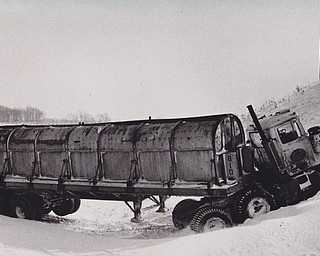 Winter's Revenge -- The aftermath of Friday's blizzard looked something like this yesterday. Leroy Montgomery, a driver for the Ohio Fast Freight Inc., escaped serious injury when his truck skidded down an incline off Interstate-80 near the Route 11 entrance ramp. Montgomery had swerved to avoid a car spinning out of control.
