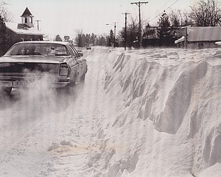Winter's Revenge -- The aftermath of Friday's blizzard looked something like this yesterday. Car-high drifts flanked a driver as he made his way along Route 46 near Smith's Corners.