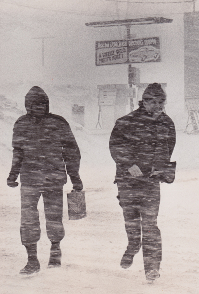 Weather was enough -- As if the extremely low temperatures and blowing snow weren't enough for any man, the fates added an empty fuel tank to the hardship of these two men, spotted Friday on Route 422, near Route 616. Their dark figures, conspicuous against the blowing snow in this picture, were almost impossible to see for some motorists, whose visibility was reduced to zero by the blizzard.