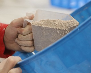        ROBERT K. YOSAY  | THE VINDICATOR..Carefullly measuring out the amount to be packaged is Evan Linko ..Hot Chocolate production in Kristin Hartshorn 3rd grade class - was at peak production on thursday afternoon as packets of Hot Chocolate .  starting with ingredients and ending up in take home bags at a buck and a half ...-30-.