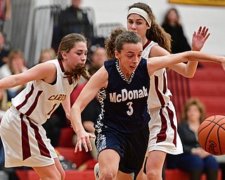 YOUNGSTOWN, OHIO - FEBRUARY 6, 2017: Olivia Perry #3 of McDonald chases after the ball after it was knocked away by the double team of Concetta Rinaldi #42 and Carolyn Kay #10 of Mooney during the first half of their game Monday night at Cardinal Mooney High School. DAVID DERMER | THE VINDICATOR