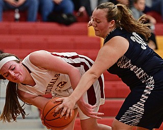 YOUNGSTOWN, OHIO - FEBRUARY 6, 2017: Taylor Martin #12 of Mooney has her pass deflected Hannah Donkers #30 of McDonald during the first half of their game Monday night at Cardinal Mooney High School. DAVID DERMER | THE VINDICATOR