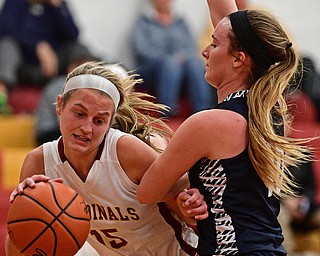 YOUNGSTOWN, OHIO - FEBRUARY 6, 2017: Lauren Fommelt #15 of Mooney drives on Kendra Kelly #10 of McDonald during the first half of their game Monday night at Cardinal Mooney High School. DAVID DERMER | THE VINDICATOR