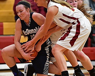 YOUNGSTOWN, OHIO - FEBRUARY 6, 2017: Kendra Kelly #10 of McDonald battles for the ball on the floor with Lauren Fommelt #15 and Taylor Martin #12 of Mooney during the first half of their game Monday night at Cardinal Mooney High School. DAVID DERMER | THE VINDICATOR