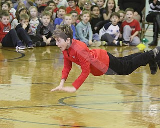        ROBERT K. YOSAY  | THE VINDICATOR..Jump for Heart as Fourth Graders at CH Campbell in Canfield.. displayed their gymnastic ability as they jumped rope in various forms..Not to be out done...  C J  Glista does push ups instead of jumpin rope....