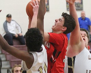 William D. Lewis The vindicator  Girard's Austin O'Hara(33) shoots over Liberty's Dan Banks(11) and Derek Gilcher(20) during Feb 7, 2017 action at Liberty.