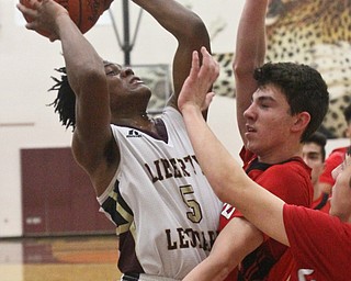 William D. Lewis The vindicator  Liberty's Dra rushton(5) shoots over girard's Austin O'Hara(33) during Feb 7, 2017 action at Liberty.
