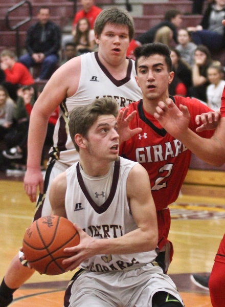 William D. Lewis The vindicator  Liberty's Kevin Hawn(3) drives around Girard's Austin claussell(2)during Feb 7, 2017 action at Liberty. In background is Liberty'sDerek Gilcher (20)