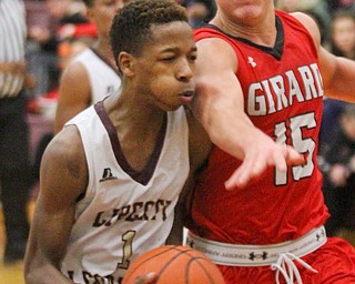 William D. Lewis The vindicator Liberty's Andre Bowers(1) drives around  giard's Mark Haid(15)during Feb 7, 2017 action at Liberty.