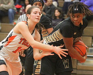 William D Lewis the vindicator  Howland's Kendyl Buckley(14) and HArding'sChiparis Alexander(21) go for the ball during Feb 8, 2017 action.