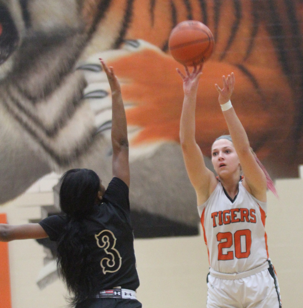 William D Lewis the vindicator  Howland's Sara Price(20) lines up a three over Harding's Kia allen(3) during Feb 8, 2017 win over Harding.