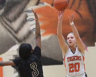 William D Lewis the vindicator  Howland's Sara Price(20) lines up a three over Harding's Kia allen(3) during Feb 8, 2017 win over Harding.